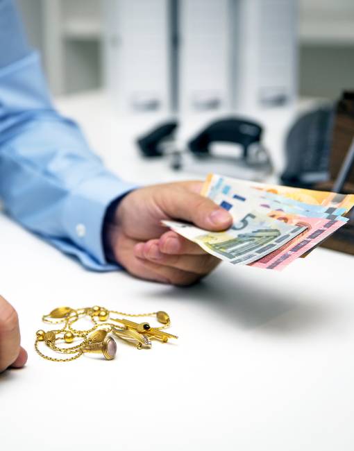 Man Buying gold, holding dollar banknotes