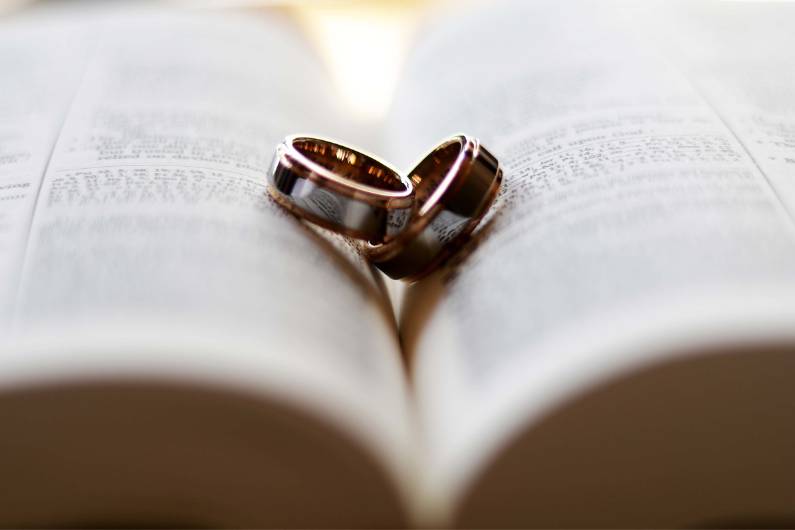 Wedding rings on the book
